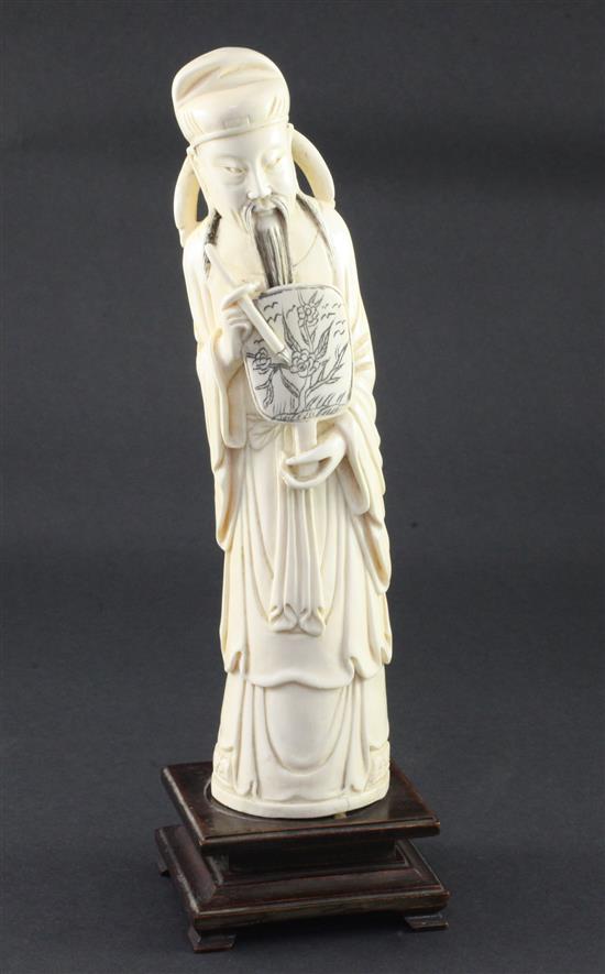 A large Chinese ivory figure of a scholar, early 20th century, 26.5cm, wood stand